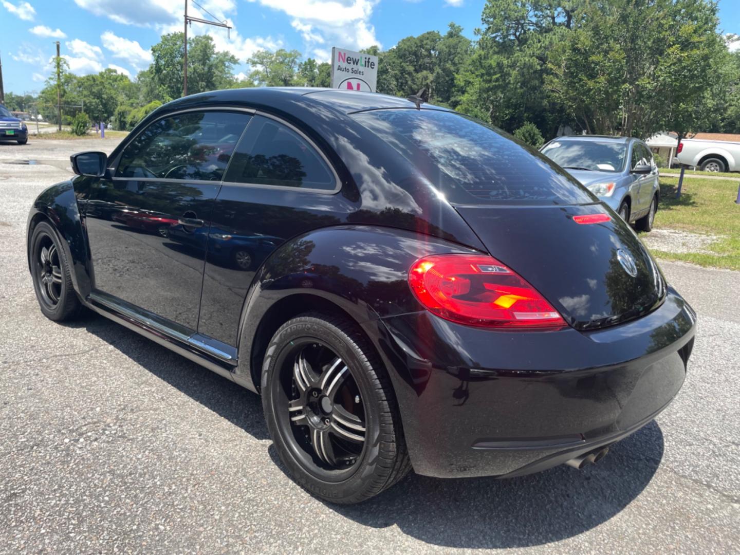 2012 BLACK VOLKSWAGEN BEETLE 2.5L PZEV (3VWJP7AT0CM) with an 2.5L engine, Automatic transmission, located at 5103 Dorchester Rd., Charleston, SC, 29418-5607, (843) 767-1122, 36.245171, -115.228050 - Local Trade-in with Leather, CD/AUX/Bluetooth, Hands-free Phone, Power Windows, Power Locks, Power Mirrors, All-weather Mats, Keyless Entry, Alloy Wheels. Clean CarFax (no accidents reported!) Only 68k miles! Located at New Life Auto Sales! 2023 WINNER for Post & Courier's Charleston's Choice Pre - Photo#4